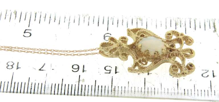 Graceful Yellow Gold Opal Filigree Pendant on Chain