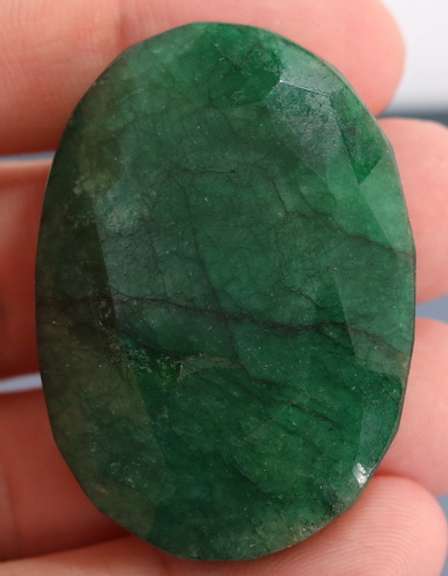 Large 152ct oval cut forest green Emerald