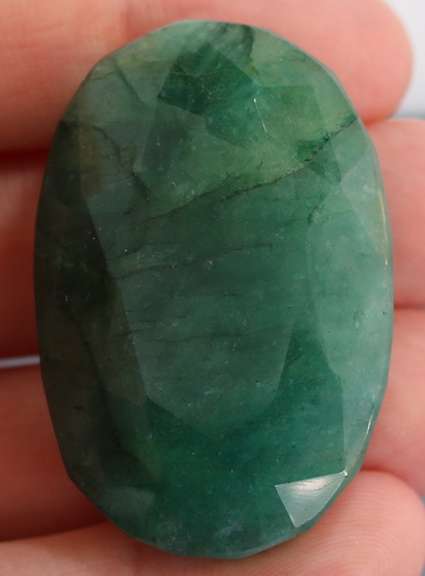 Large 160.5ct oval cut forest green Emerald