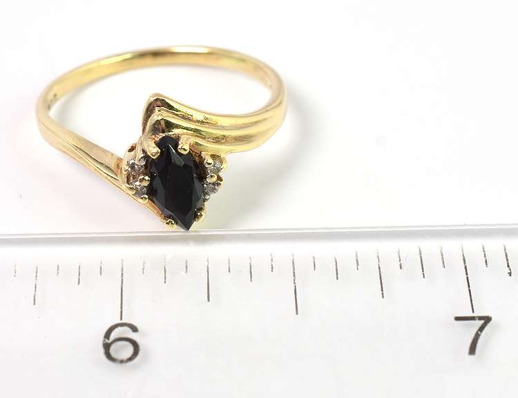 Mysterious Black Stone Ring with Diamond Accents in Yellow Gold