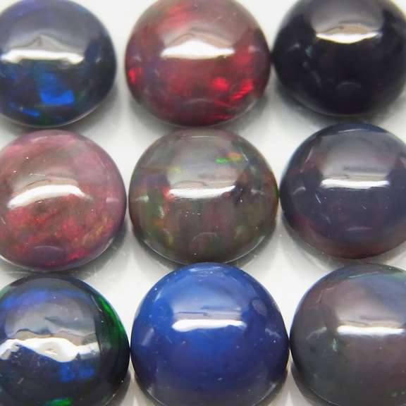 UNHEATED! 4.53ct Black Opal set with smoldering play of color