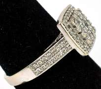 Striking 3/4CTW Diamond Halo Ring in 14KT White Gold