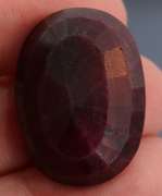 Fiery 66.5ct oval cut deep red Ruby
