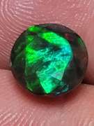 Smoldering 1.54ct round cut Welo black Opal