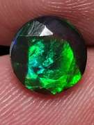 Smoldering 1.54ct round cut Welo black Opal