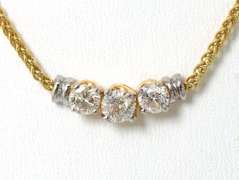 Breathtaking 3-Stone 0.90CTW Diamond Necklace in 14KT Yellow Gold