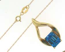 Charming Emerald Cut Blue Topaz Yellow Gold Necklace