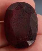 Fiery 66.5ct oval cut deep red Ruby