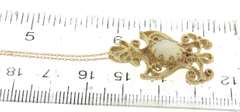 Graceful Yellow Gold Opal Filigree Pendant on Chain