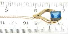 Charming Emerald Cut Blue Topaz Yellow Gold Necklace