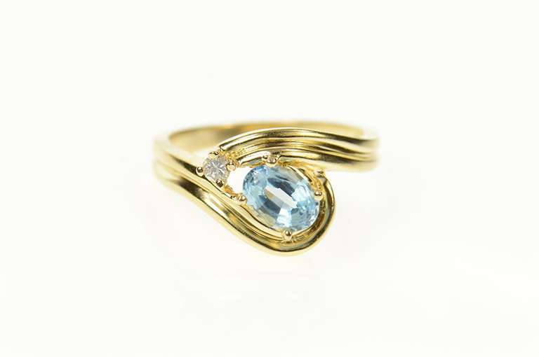 14K Yellow Gold Ornate Blue Topaz Diamond Wavy Bypass Ring