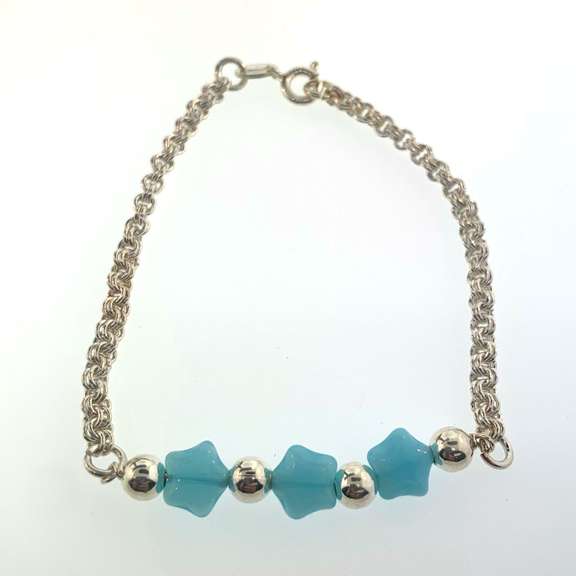Sterling silver bracelet with light blue star charms and round silver beads