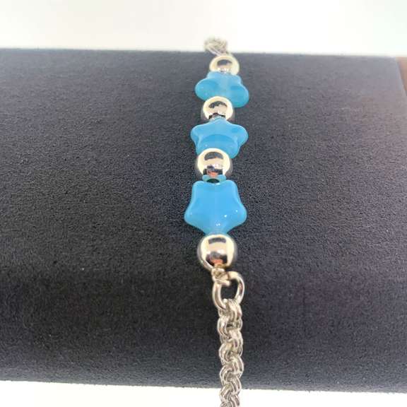 Sterling silver bracelet with light blue star charms and round silver beads
