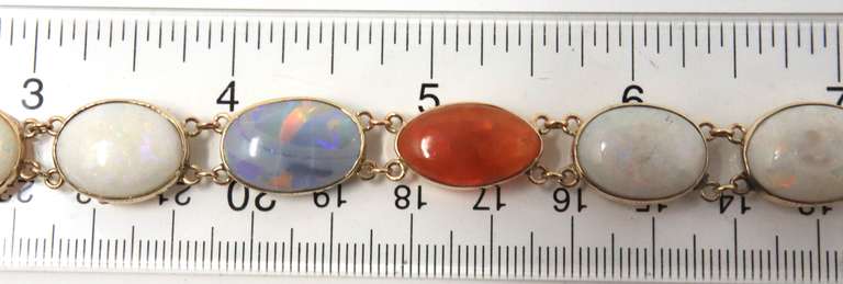Dynamic Seven Bezel Set Shaped Cut Natural Multi Color Opals Bracelet