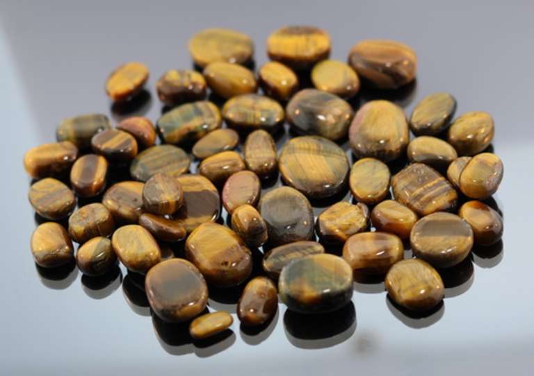 Huge collection of Tigerseye cabochons weighing 325 carats!
