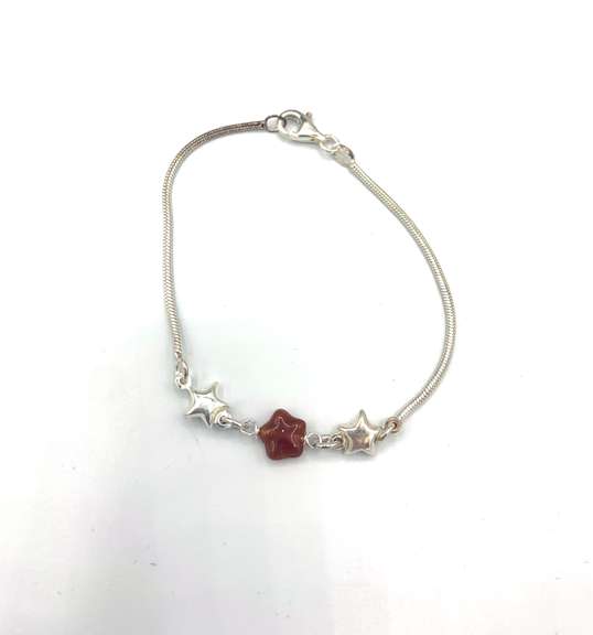 Sterling silver bracelet with orange & silver star charms