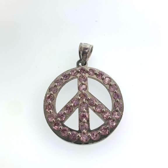 Sterling silver peace pendant with pink gemstones