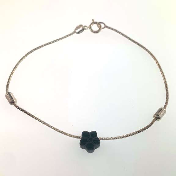 Sterling silver bracelet with dark grey flower charm