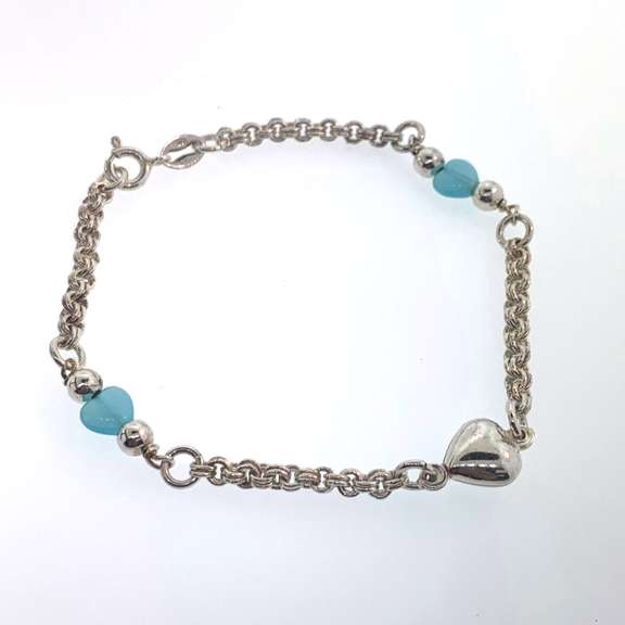 Sterling silver bracelet with silver and light blue heart charms and round silver beads