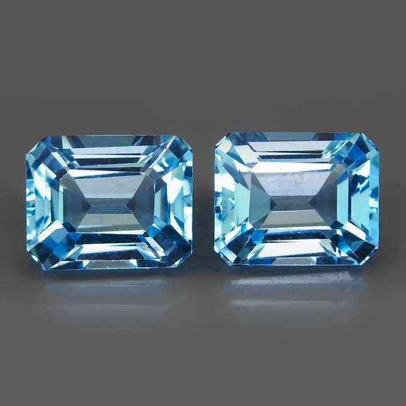 Stunningly well matched 11.95ct vibrant blue pair of Topaz