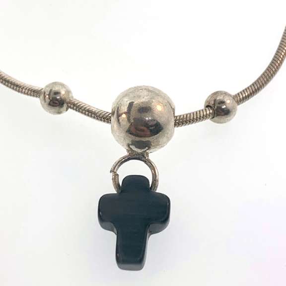 Sterling silver bracelet with three silver bead and a grey/black cross charm