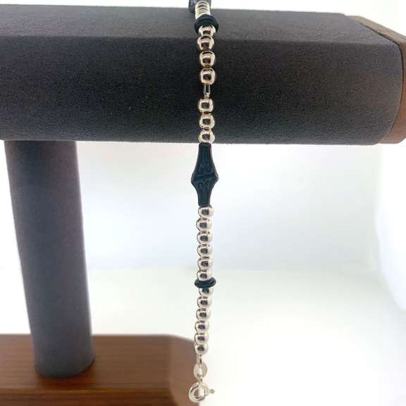 Sterling silver bracelet with silver beads and unique black charms