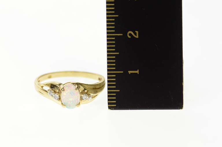 10K Yellow Gold Classic Syn. Opal CZ Accent Bypass Ring