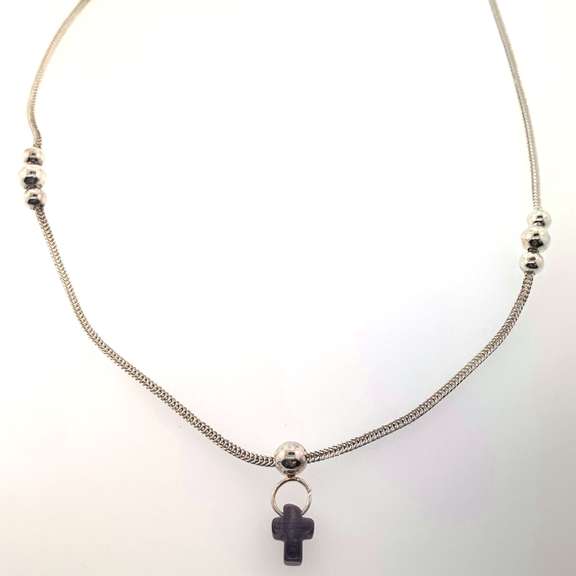 Sterling silver necklace with a purple cross charm and silver beads