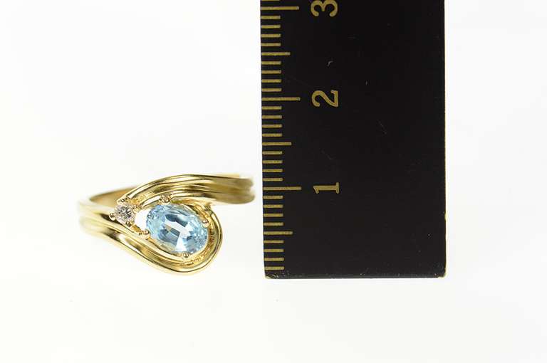 14K Yellow Gold Ornate Blue Topaz Diamond Wavy Bypass Ring