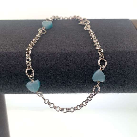 Sterling silver bracelet with light blue heart charms