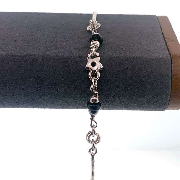 Sterling silver bracelet with black and silver beads and silver star charm