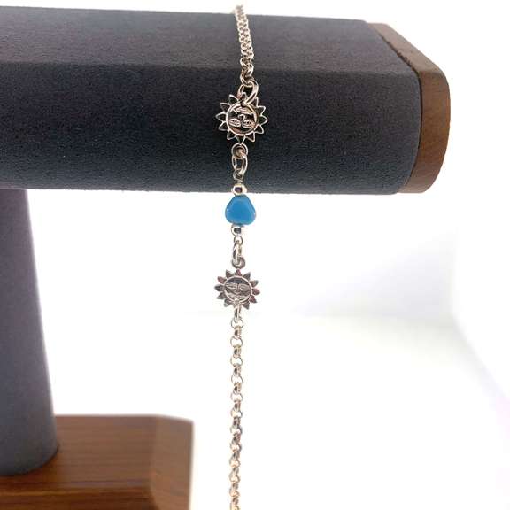 Sterling silver bracelet with light blue hearts and sun charms