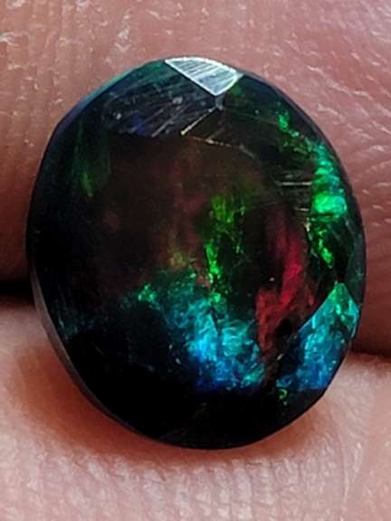 Smoldering floral block flashing 1.53ct Welo black Opal