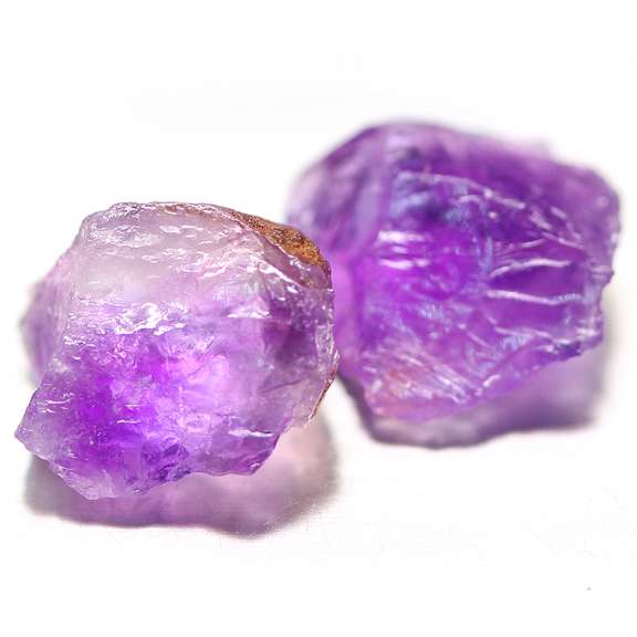 Bright purple 16.37ct uncut amethyst pair