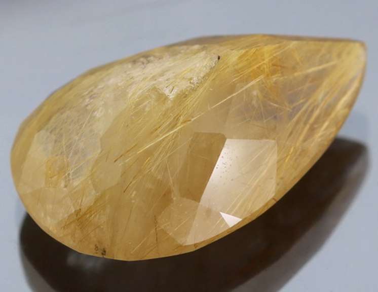 Fully faceted 23.95ct golden rutile Quartz