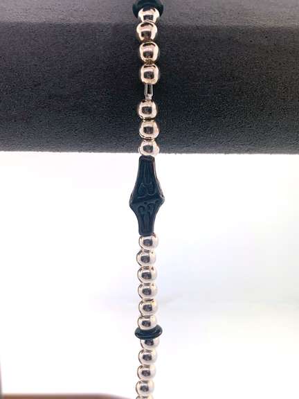 Sterling silver bracelet with silver beads and unique black charms