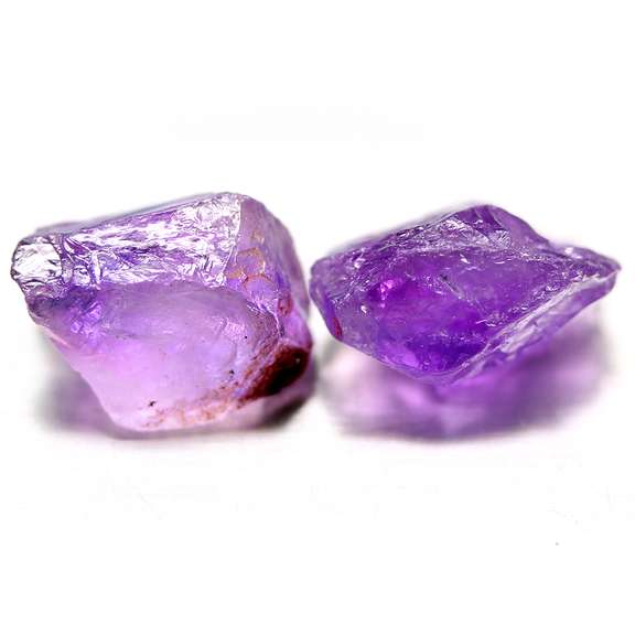 Bright purple 16.37ct uncut amethyst pair