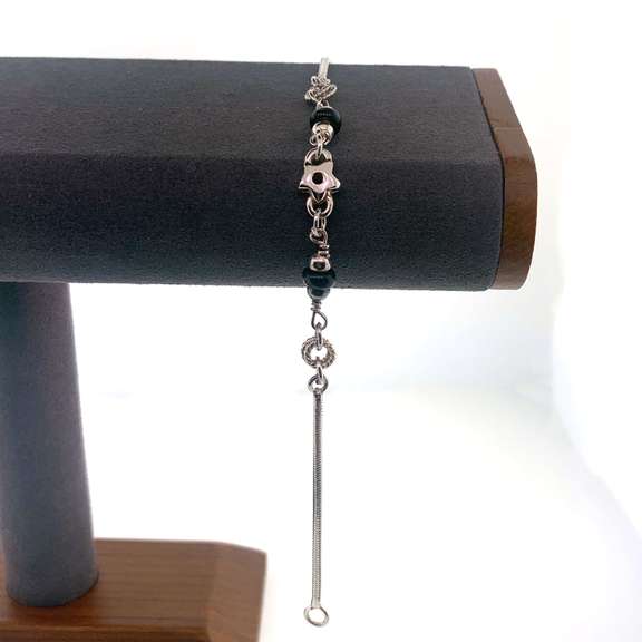 Sterling silver bracelet with black and silver beads and silver star charm