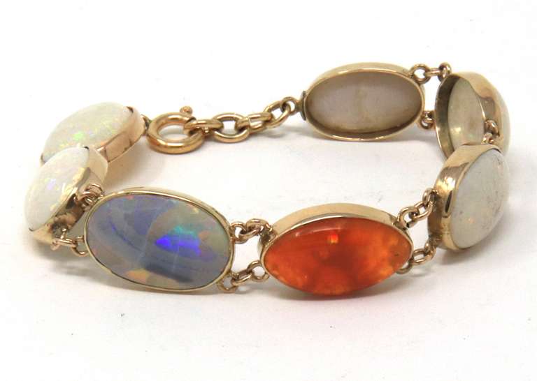 Dynamic Seven Bezel Set Shaped Cut Natural Multi Color Opals Bracelet