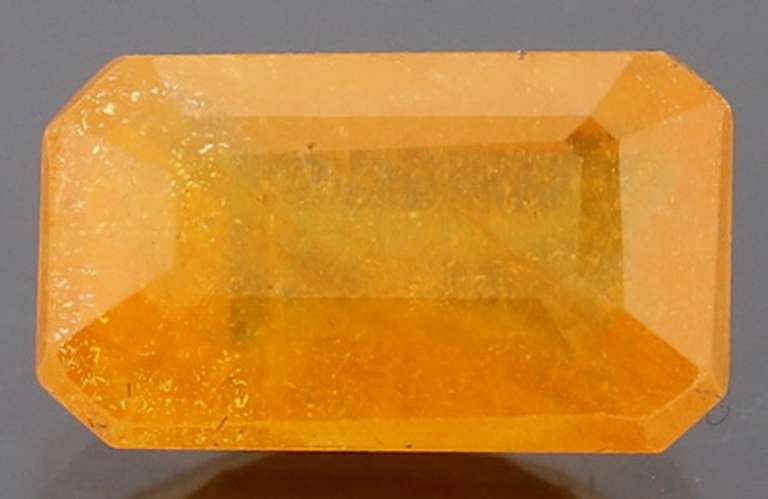 Vibrant 4.29ct emerald cut orange Sapphire