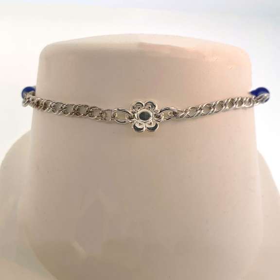 Sterling silver bracelet with blue beads and flower charm
