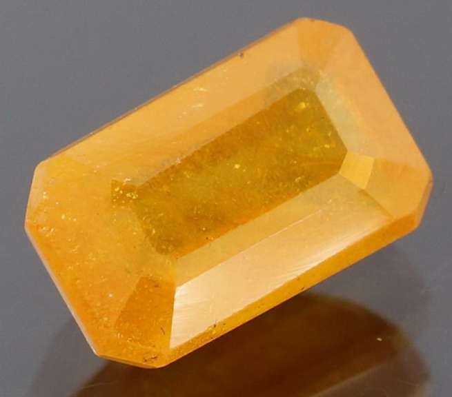Vibrant 4.29ct emerald cut orange Sapphire