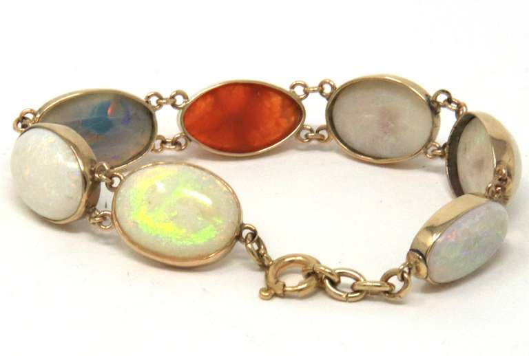 Dynamic Seven Bezel Set Shaped Cut Natural Multi Color Opals Bracelet