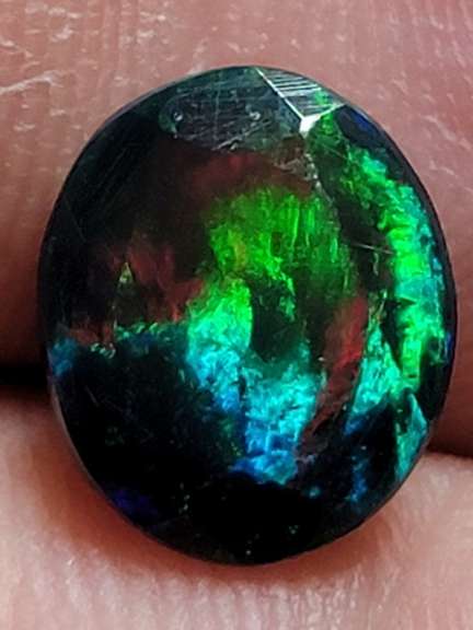 Smoldering floral block flashing 1.53ct Welo black Opal