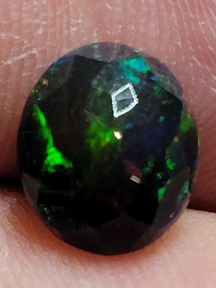 Smoldering floral block flashing 1.53ct Welo black Opal