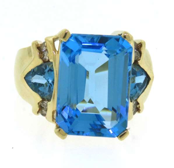 Charming Emerald Cut Blue Topaz & Diamond Ring