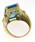 Charming Emerald Cut Blue Topaz & Diamond Ring