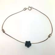 Sterling silver bracelet with dark grey flower charm