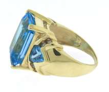 Charming Emerald Cut Blue Topaz & Diamond Ring