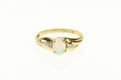 10K Yellow Gold Classic Syn. Opal CZ Accent Bypass Ring